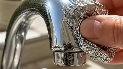Aluminium Foil Cleaning Hack: Aluminium foil tap cleaning hack: A simple and practical way to clean stained surfaces and prevent household damage Aluminium Foil Cleaning Hack: Aluminium foil tap cleaning hack: A simple and practical way to clean stained surfaces and prevent household damage