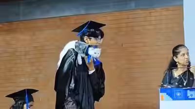 Cat attends convocation with graduate; professors’ reaction leaves internet amused | Cat attends convocation with graduate; professors’ reaction leaves internet amused |