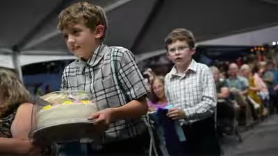 Maryland 10-year-old Herbie Martin IV stayed up until 2 a.m. perfecting his lemon blueberry buttercream cake; the grand champion cake sold for $15,000 Maryland 10-year-old Herbie Martin IV stayed up until 2 a.m. perfecting his lemon blueberry buttercream cake; the grand champion cake sold for $15,000