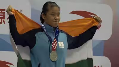 Roshibina Devi assures medal after second chance, one win away from Asian Games final | Asian Games 2026 News Roshibina Devi assures medal after second chance, one win away from Asian Games final | Asian Games 2026 News