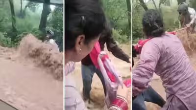 Newlywed woman takes off her dupatta to save biker trapped in Himachal flash flood; dramatic rescue by a family caught in camera; video viral Newlywed woman takes off her dupatta to save biker trapped in Himachal flash flood; dramatic rescue by a family caught in camera; video viral