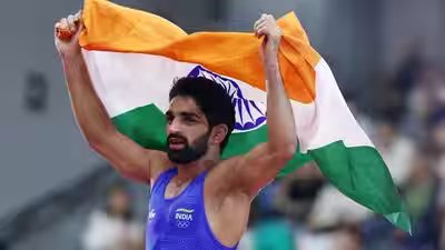 Screensaver turns real: Aman Sehrawat’s gold on phone now around his neck | Asian Games 2026 News Screensaver turns real: Aman Sehrawat’s gold on phone now around his neck | Asian Games 2026 News