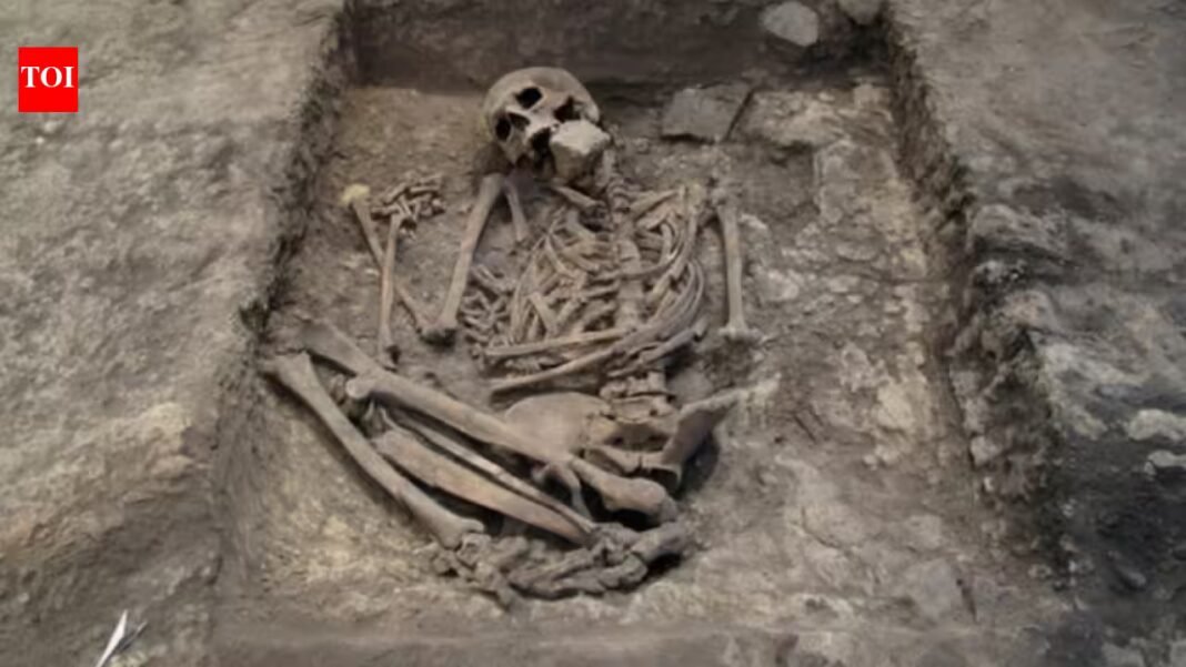 He was buried beneath a hearth, with a large stone pressed against his mouth and face, just one cm below the floor people walked on; researchers now suggest the 3,700-year-old burial was part of a magical ritual, not a punishment He was buried beneath a hearth, with a large stone pressed against his mouth and face, just one cm below the floor people walked on; researchers now suggest the 3,700-year-old burial was part of a magical ritual, not a punishment